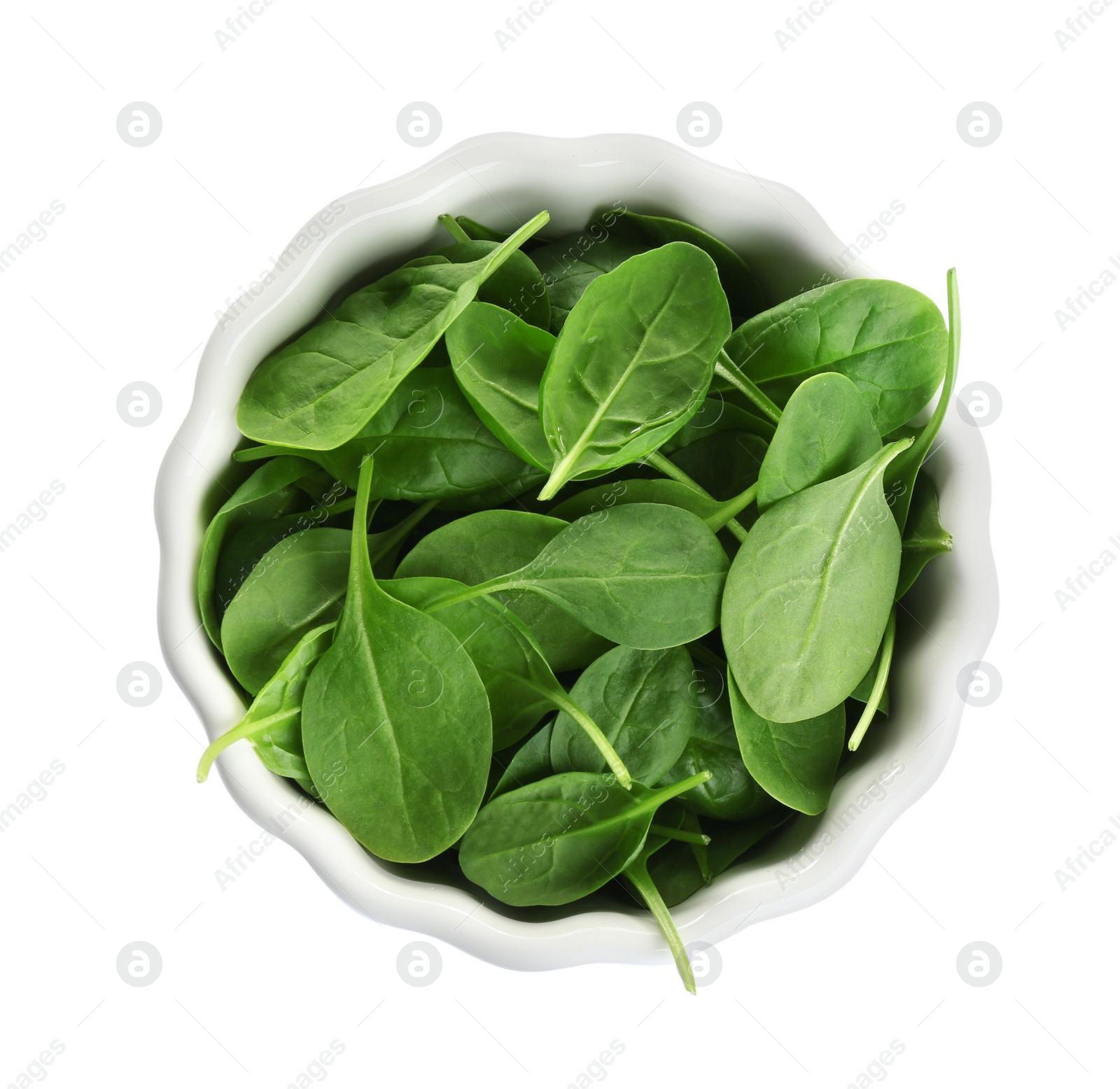 Photo of Bowl of fresh green healthy baby spinach on white background, top view