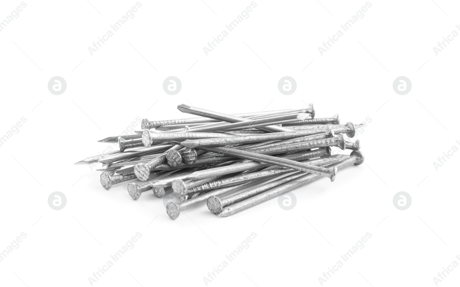 Photo of Pile of metal nails on white background