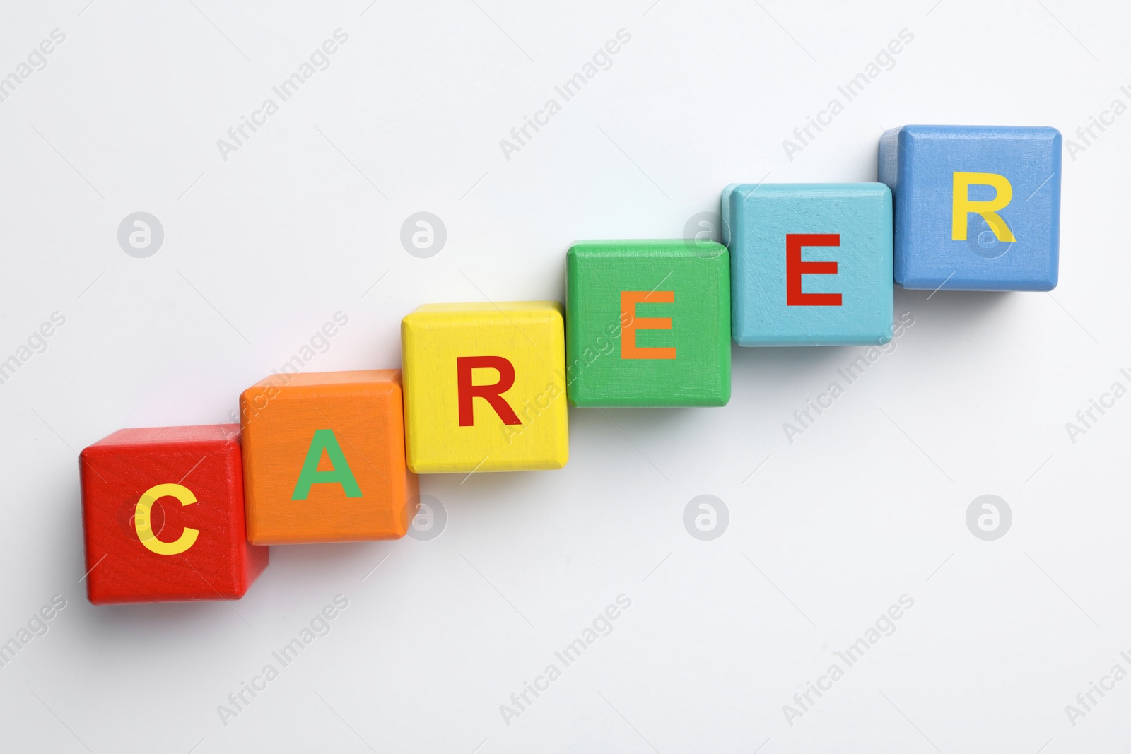 Photo of Colorful cubes with word CAREER on white background, top view