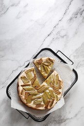 Photo of Freshly baked rhubarb pie on white marble table, top view. Space for text