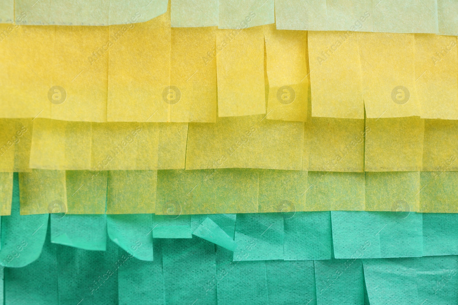 Photo of Cut tissue paper in different colors as background