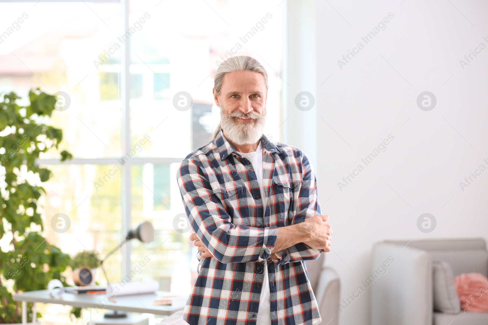 Photo of Portrait of handsome mature man in shirt, indoors