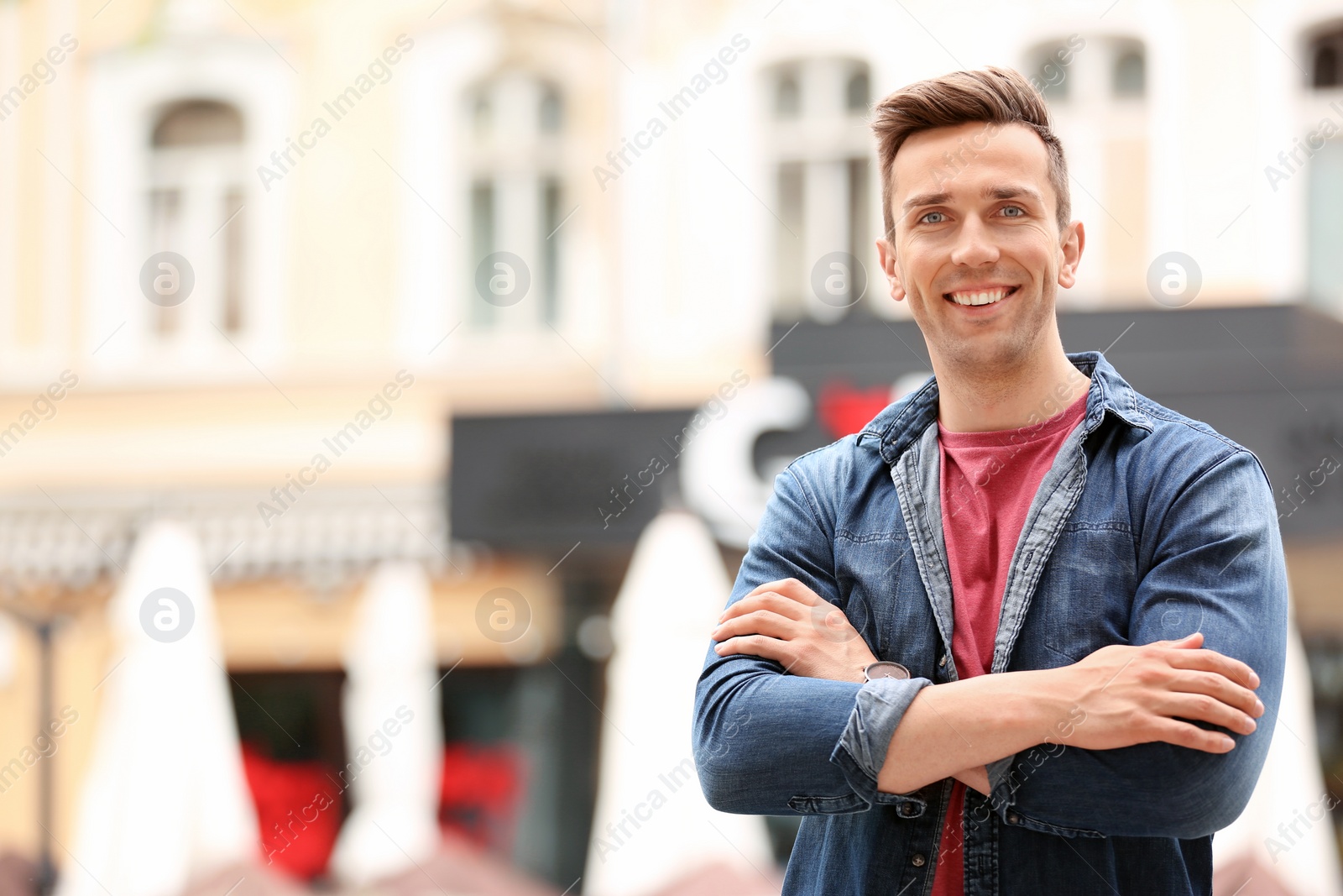 Photo of Portrait of attractive young man in stylish outfit outdoors