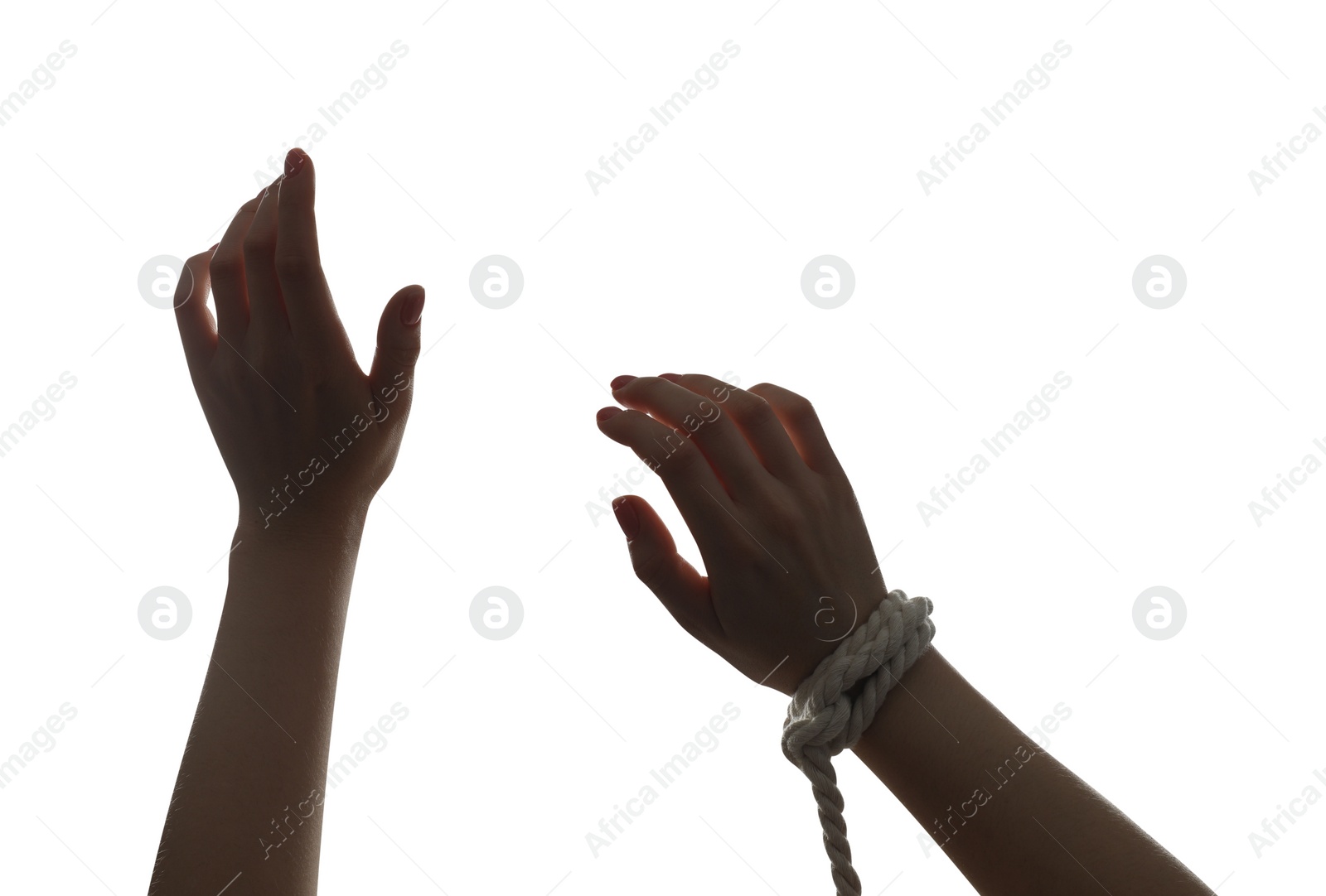 Photo of Freedom concept. Woman with rope on her hand against white background, closeup