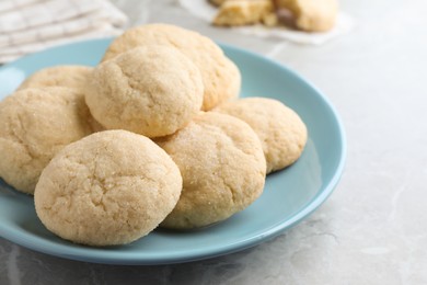 Delicious sugar cookies on light grey marble table, closeup