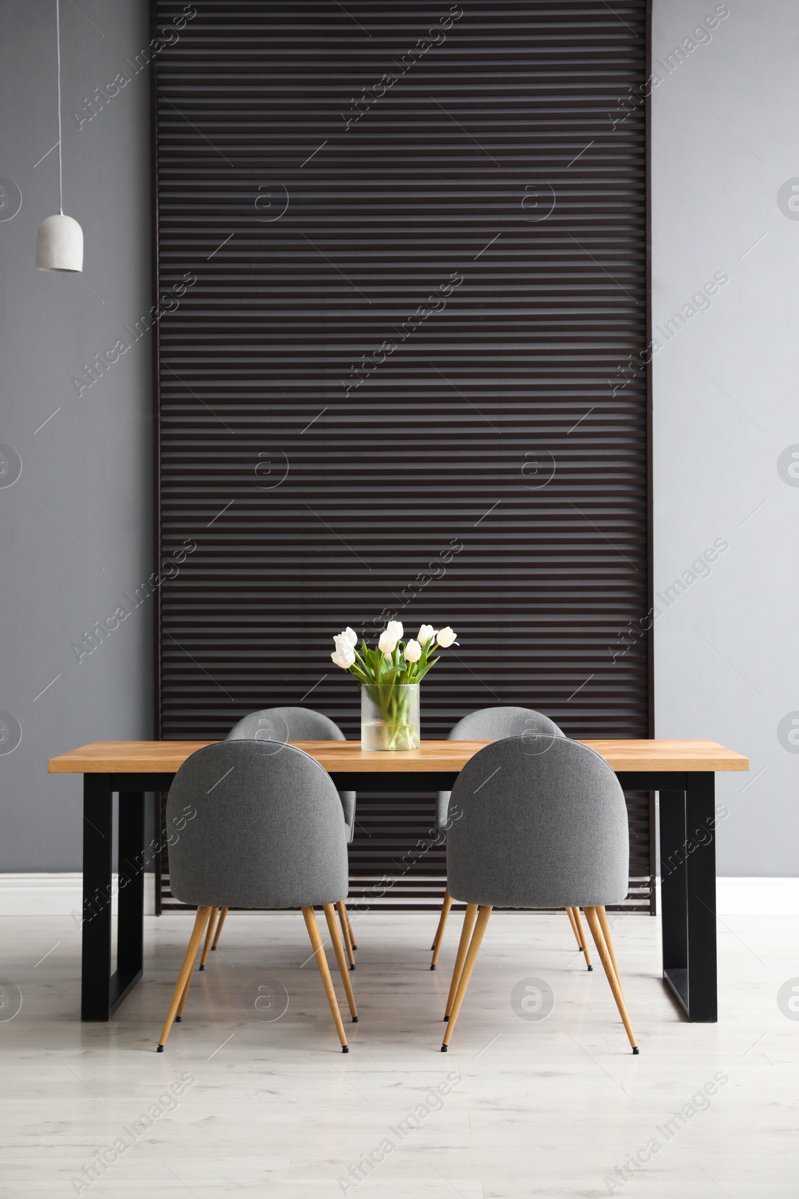 Photo of Table and chairs in room. Stylish interior design