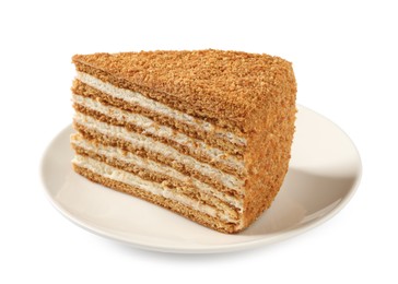 Slice of delicious layered honey cake isolated on white