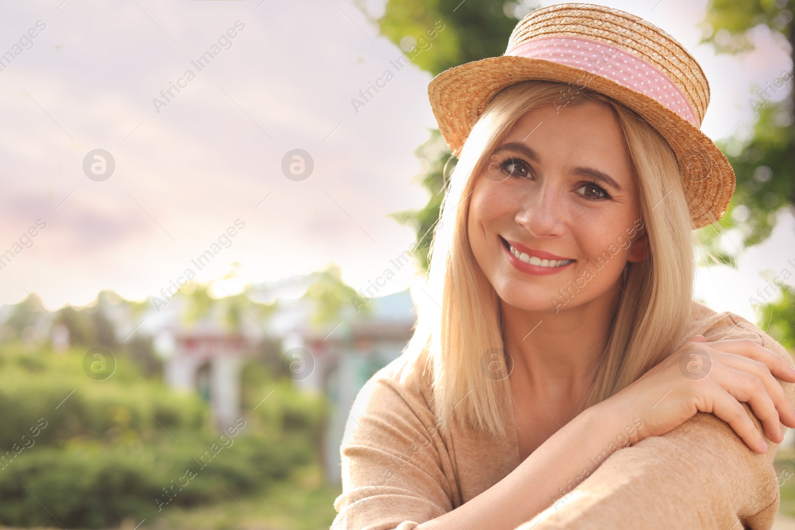 Photo of Portrait of beautiful woman in straw hat outdoors on sunny day