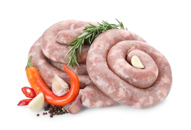 Photo of Homemade sausages, garlic, chili, rosemary and peppercorns isolated on white