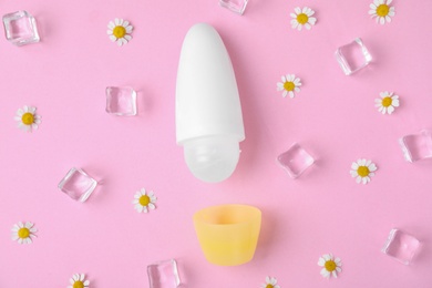 Photo of Flat lay composition with natural female roll-on deodorant on pink background