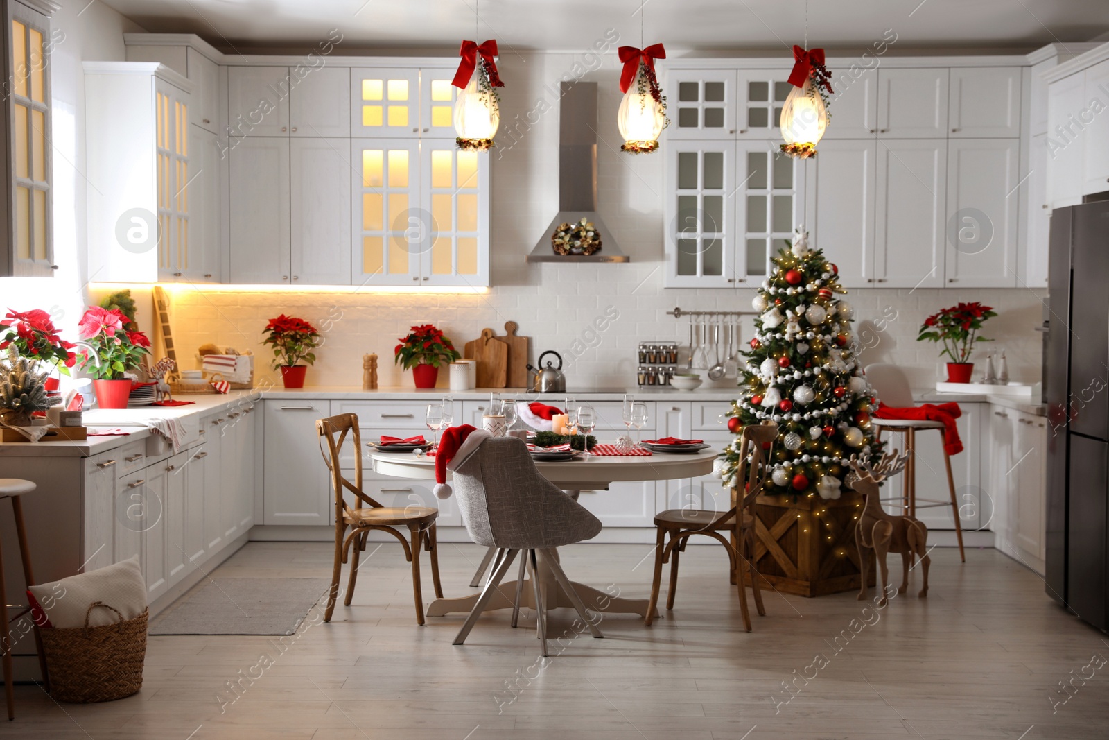 Photo of Stylish kitchen interior with beautiful Christmas decor