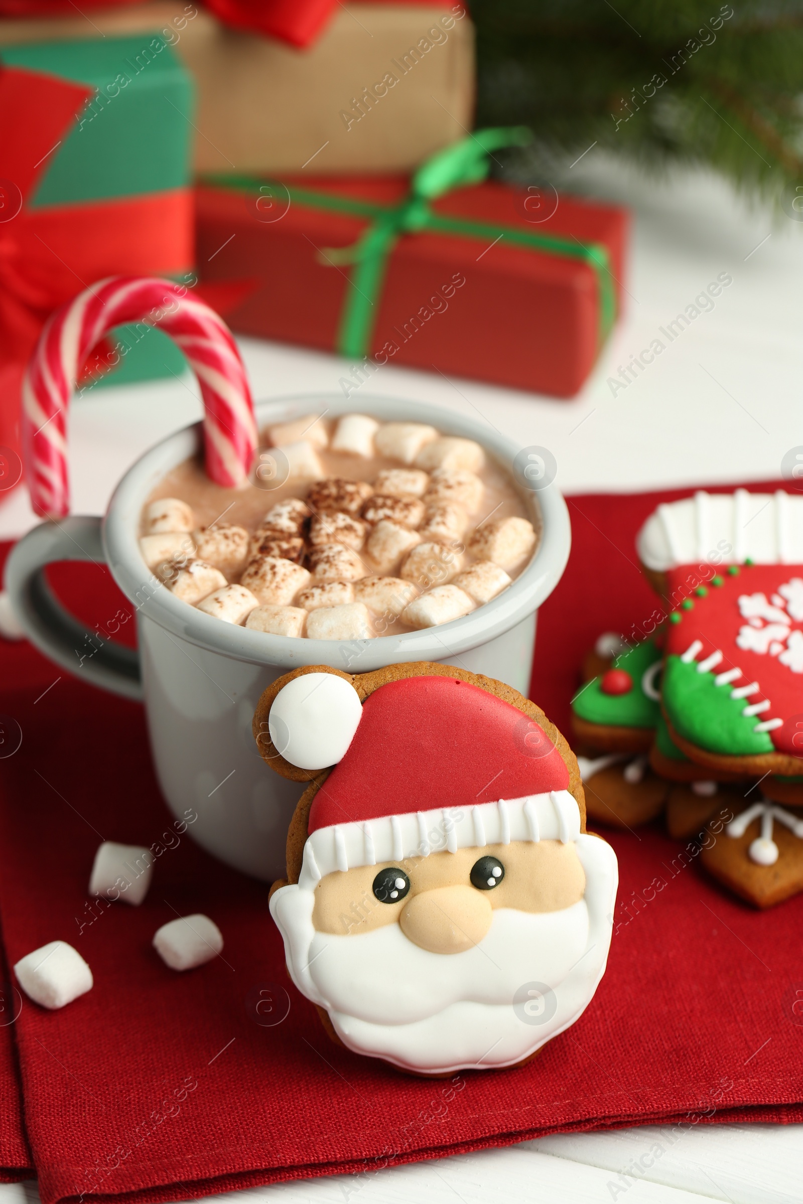 Photo of Tasty homemade Christmas cookies and hot chocolate with marshmallows on white table