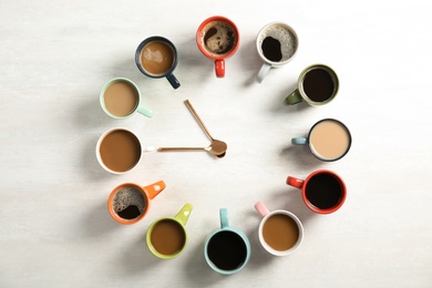 Flat lay composition with cups of coffee on light background. Food photography