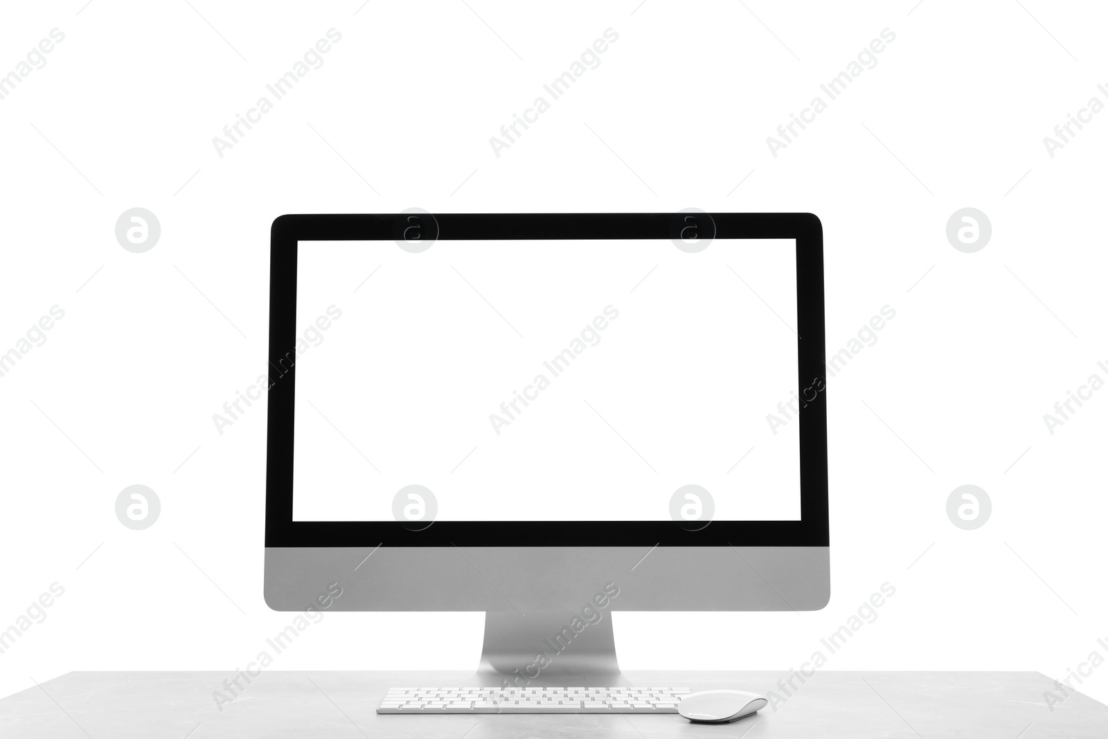 Photo of New computer with blank monitor screen, keyboard and mouse on white background