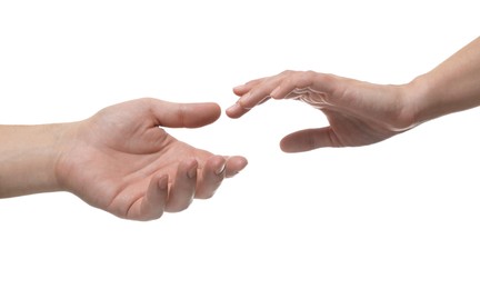 Photo of Man and woman reaching to each other on white background, closeup of hands