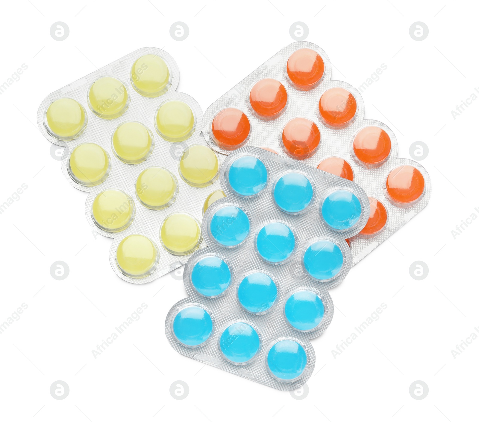 Photo of Blisters with colorful cough drops on white background, top view