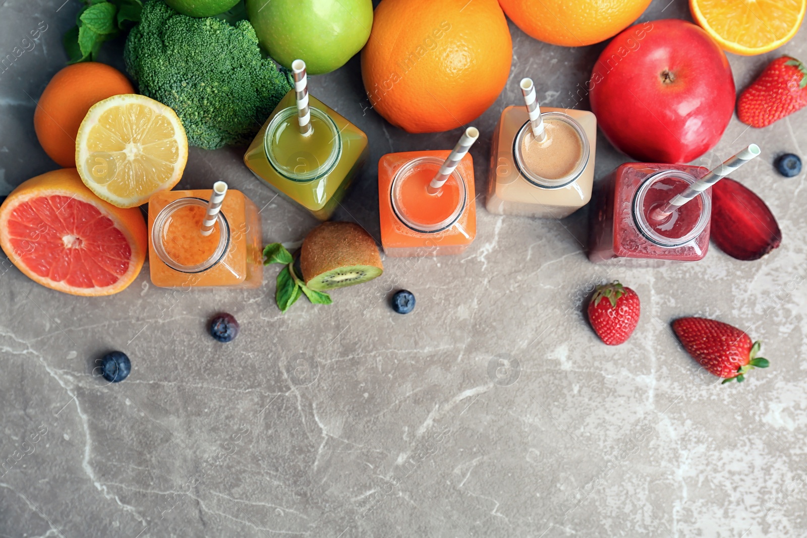 Photo of Flat lay composition with healthy detox smoothies and ingredients on table