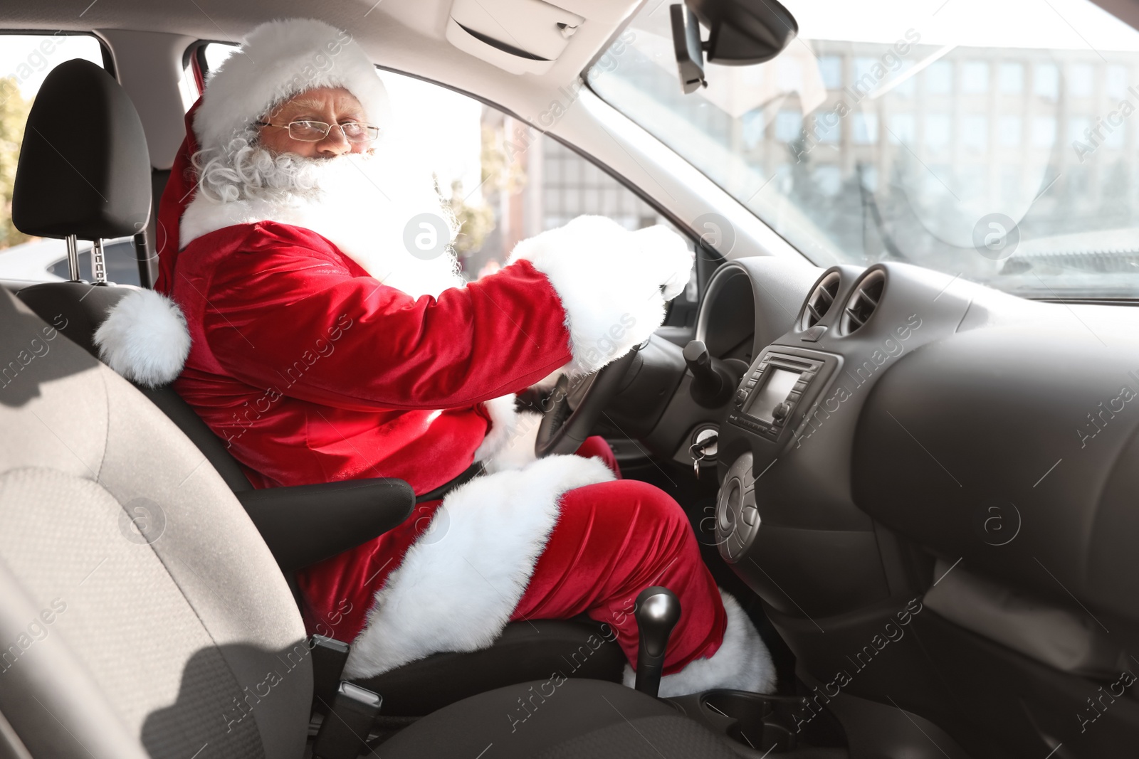 Photo of Authentic Santa Claus driving car, view from inside