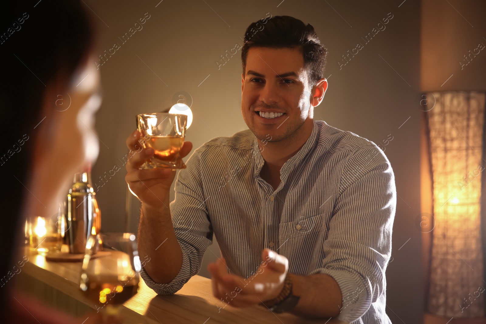 Photo of Man and woman flirting with each other in bar