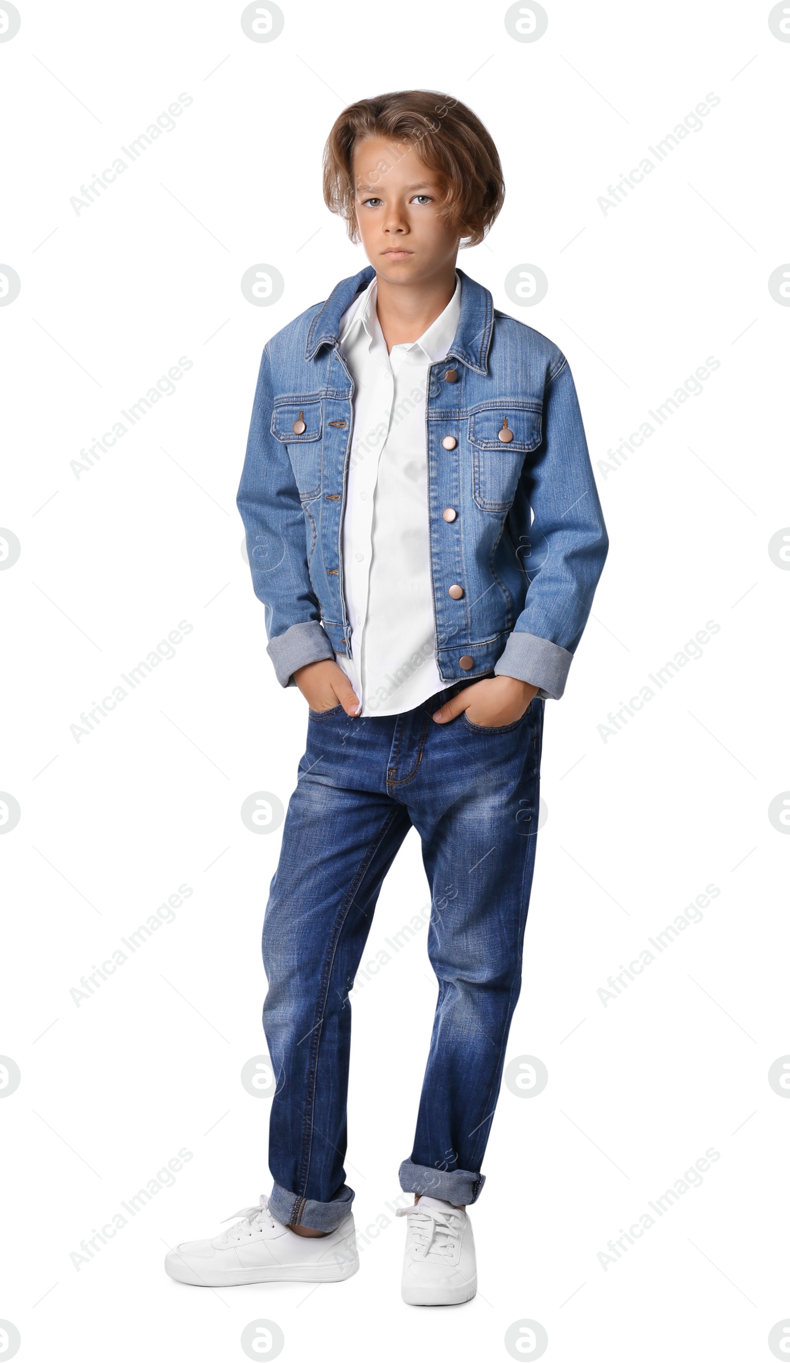 Photo of Portrait of cute little boy in casual outfit on white background