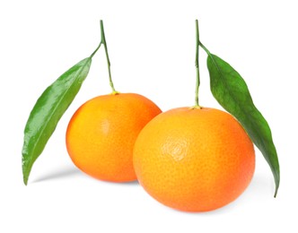 Photo of Fresh ripe juicy tangerines with green leaves isolated on white