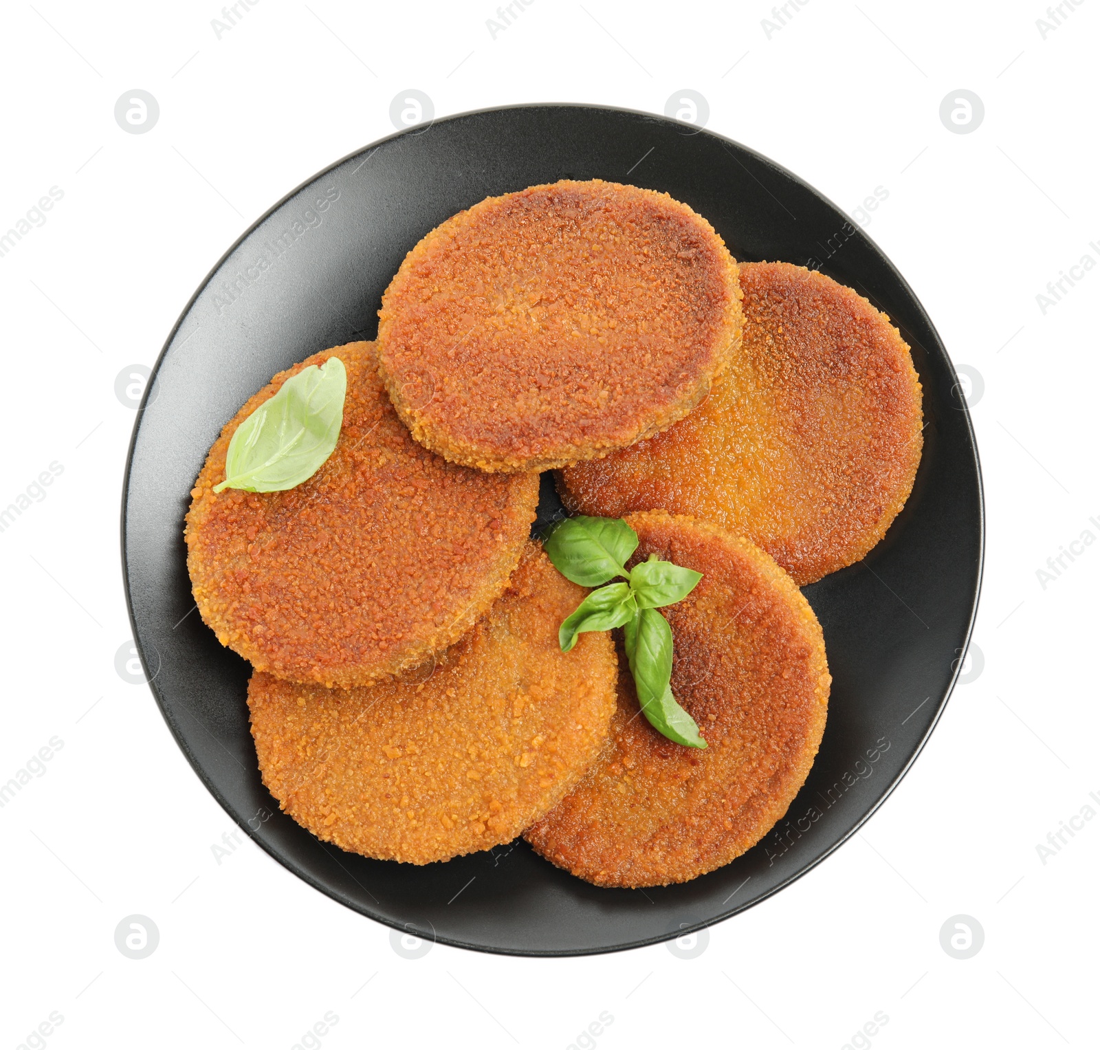 Photo of Delicious fried breaded cutlets with basil leaves isolated on white, top view