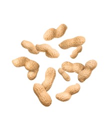 Image of Unpeeled peanuts in air on white background