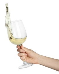 Photo of Woman with tasty aromatic wine splashing out of glass on white background, closeup
