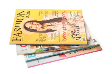 Photo of Stack of different magazines on white background