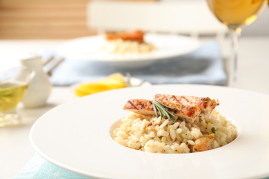 Delicious chicken risotto served on table, closeup