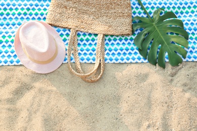 Photo of Composition with beach accessories on sand, flat lay. Space for text