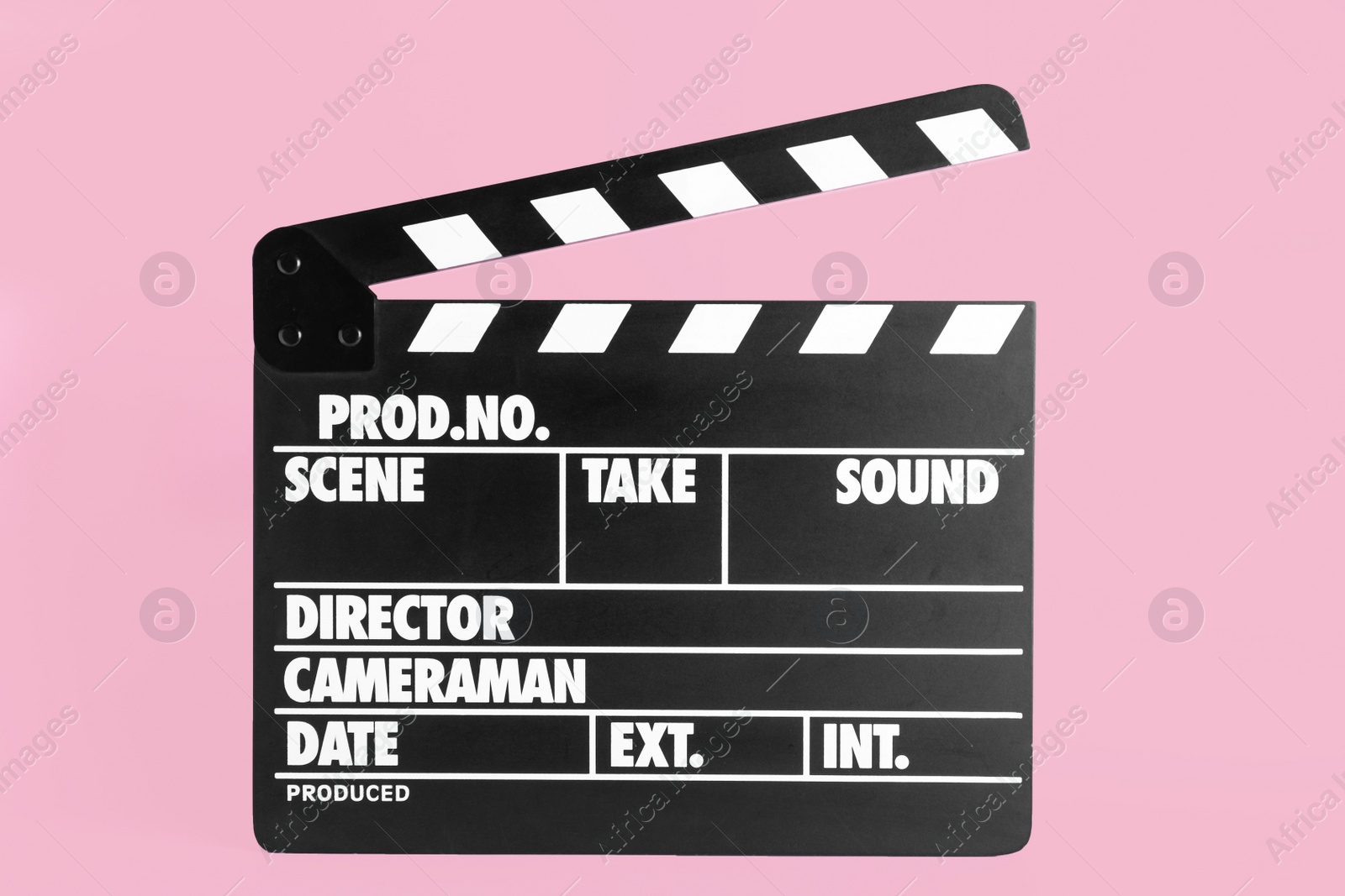 Photo of Clapper board on pink background. Cinema production