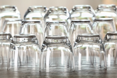 Photo of Set of empty glasses on wooden table