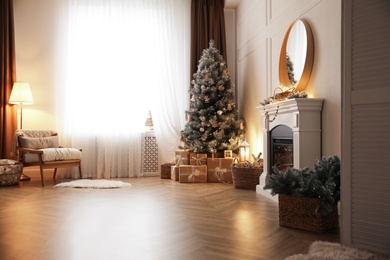 Beautiful living room interior with decorated Christmas tree and gifts