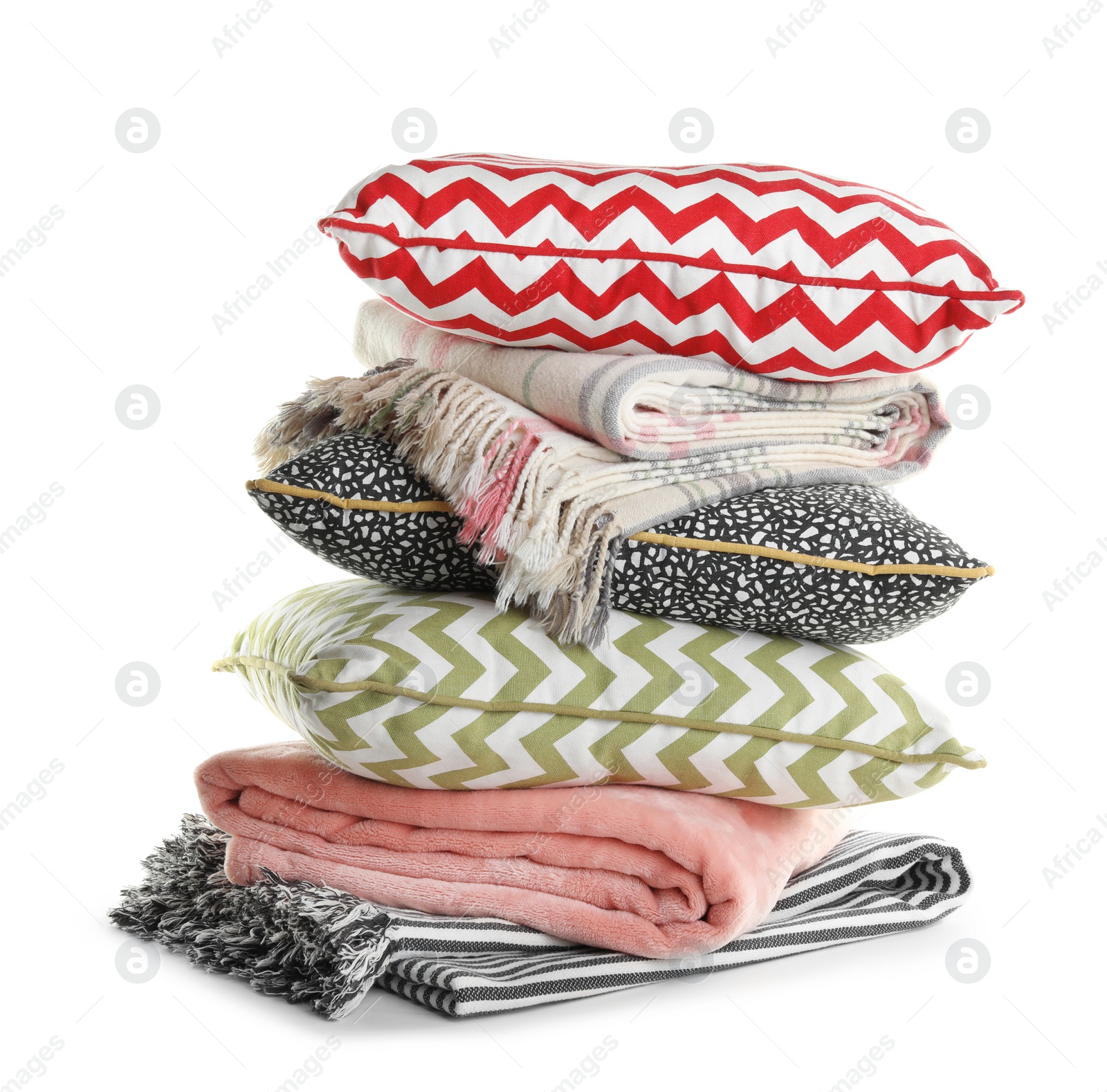 Photo of Stylish soft pillows and folded plaids on white background