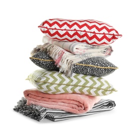 Photo of Stylish soft pillows and folded plaids on white background