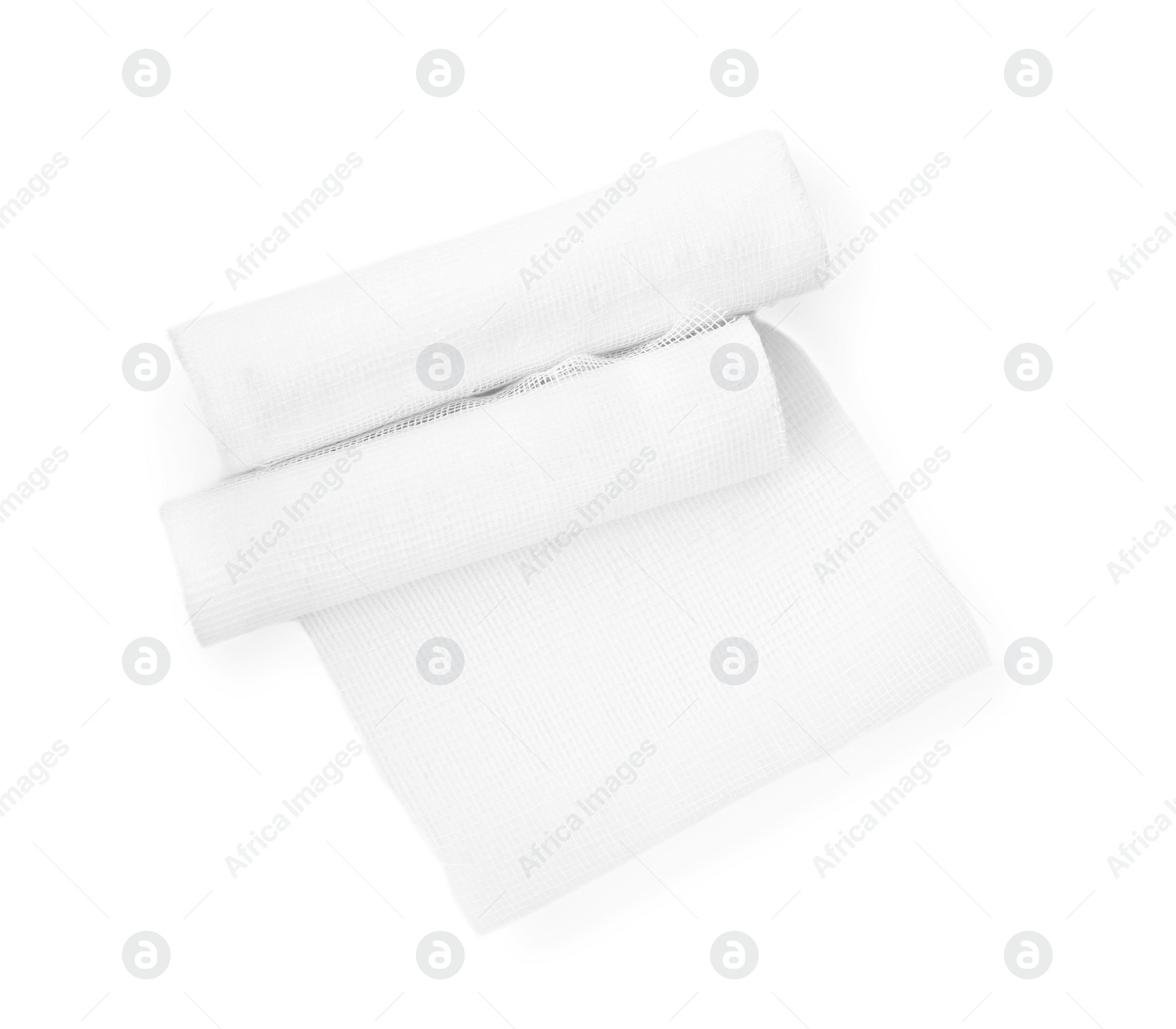 Photo of Medical gauze bandage rolls on white background, top view