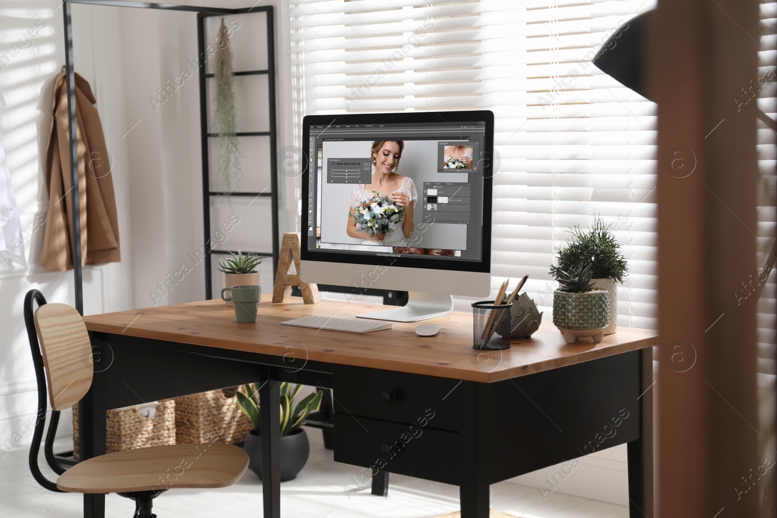 Image of Designer's workplace. Computer with photo editor application on table indoors