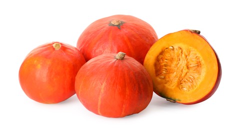Photo of Many whole and cut ripe pumpkins on white background