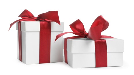 Boxes with Christmas gifts on white background