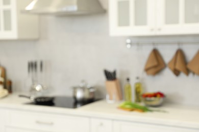 Photo of Blurred view of modern kitchen. Interior design