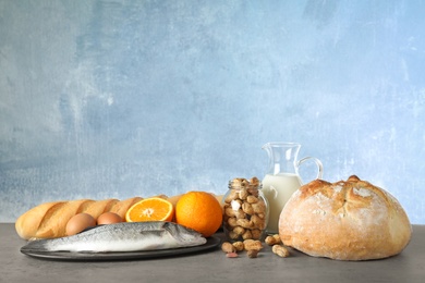 Photo of Set of natural products on table against light blue background, space for text. Food allergy