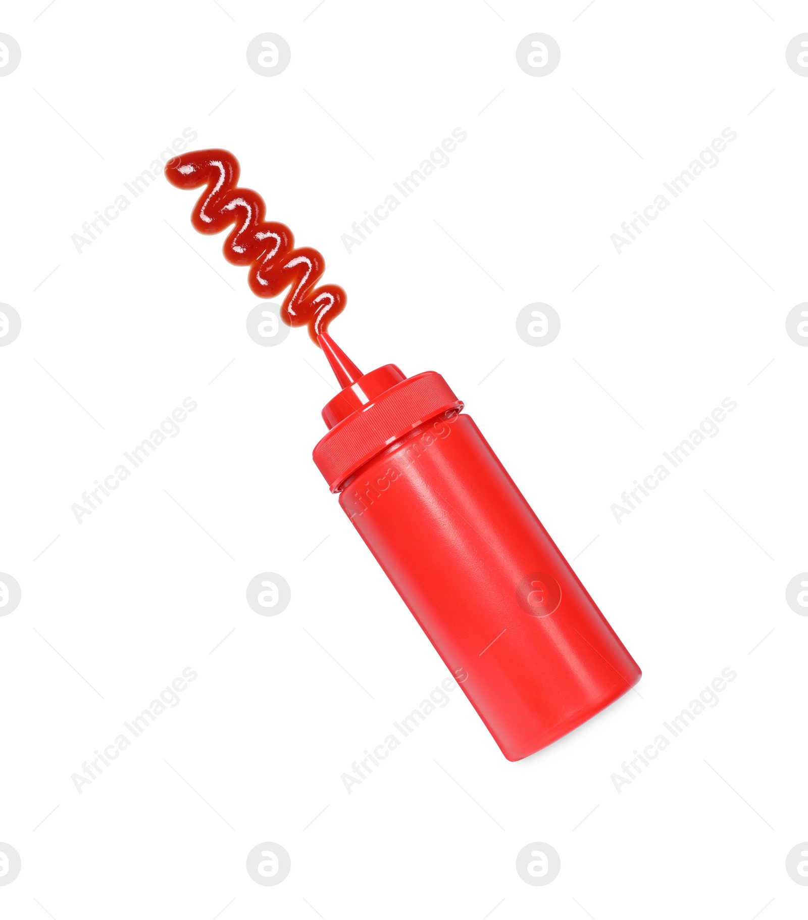 Photo of Squeezed ketchup from red bottle isolated on white, top view