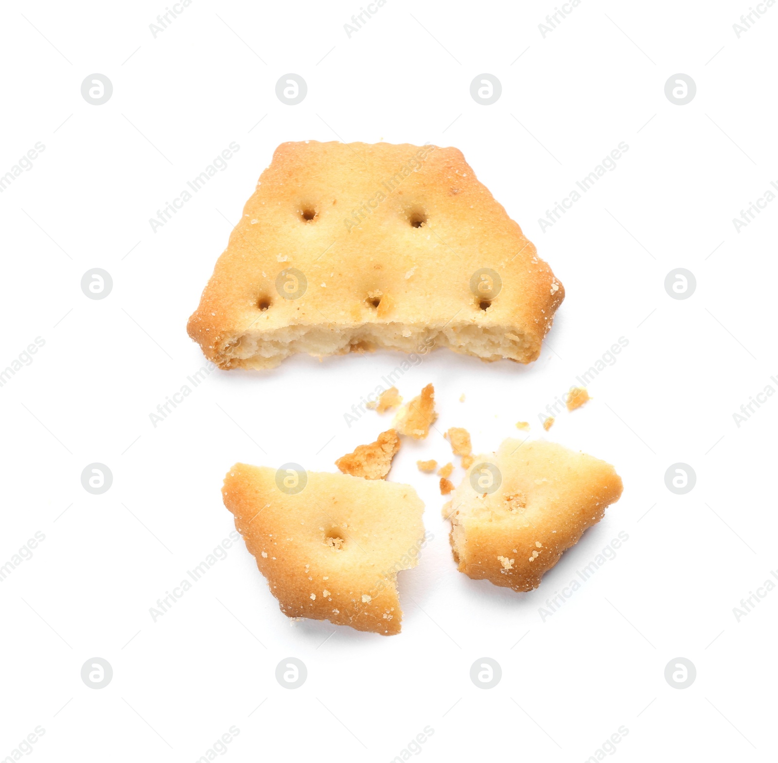 Photo of Broken delicious crispy cracker isolated on white, top view