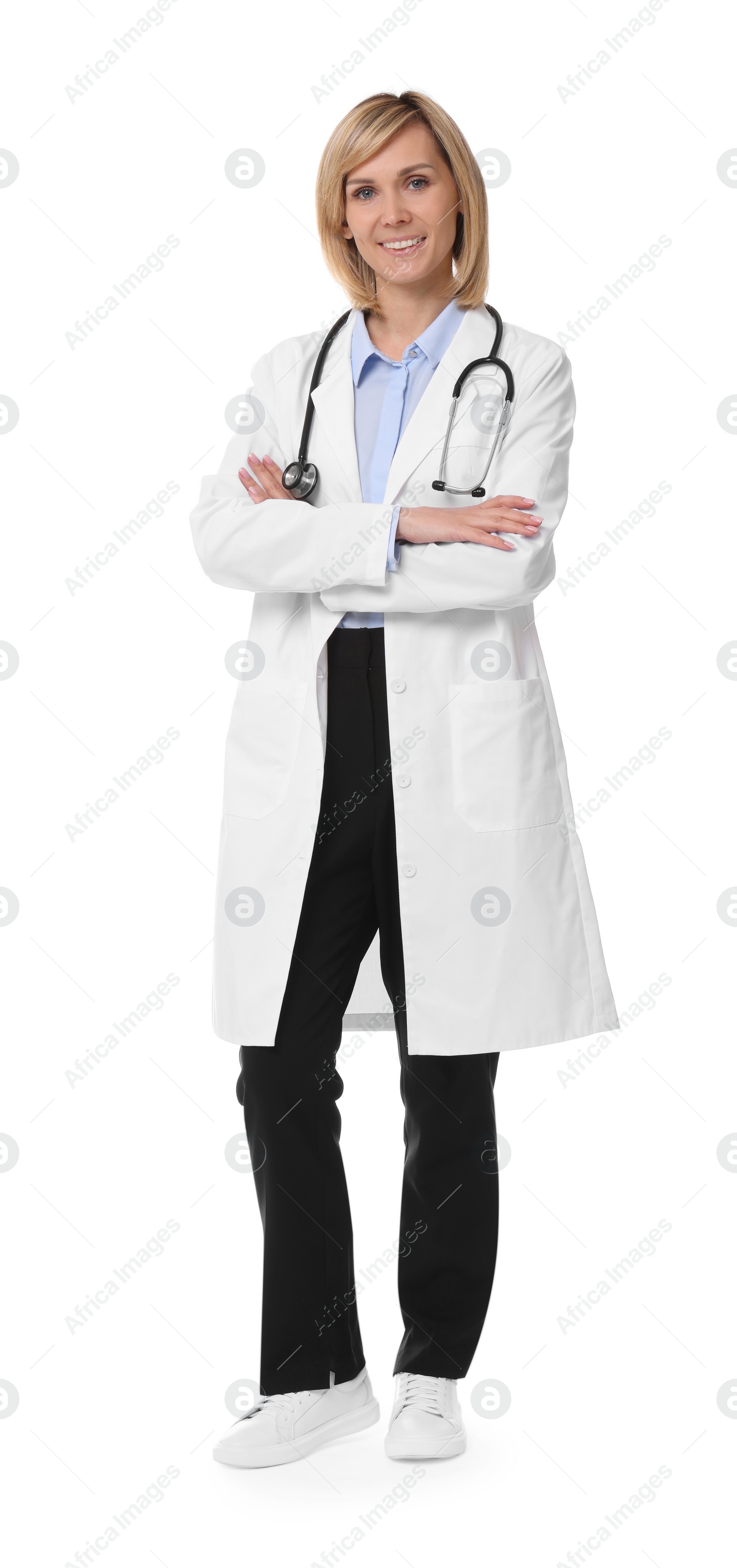 Photo of Smiling doctor with crossed arms on white background