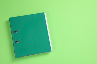 Photo of Office folder on light green background, top view