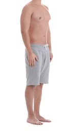 Photo of Young athletic man on white background, closeup. Weight loss