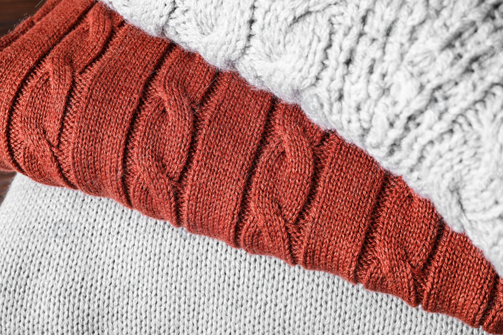 Image of Stack of folded warm sweaters, closeup view