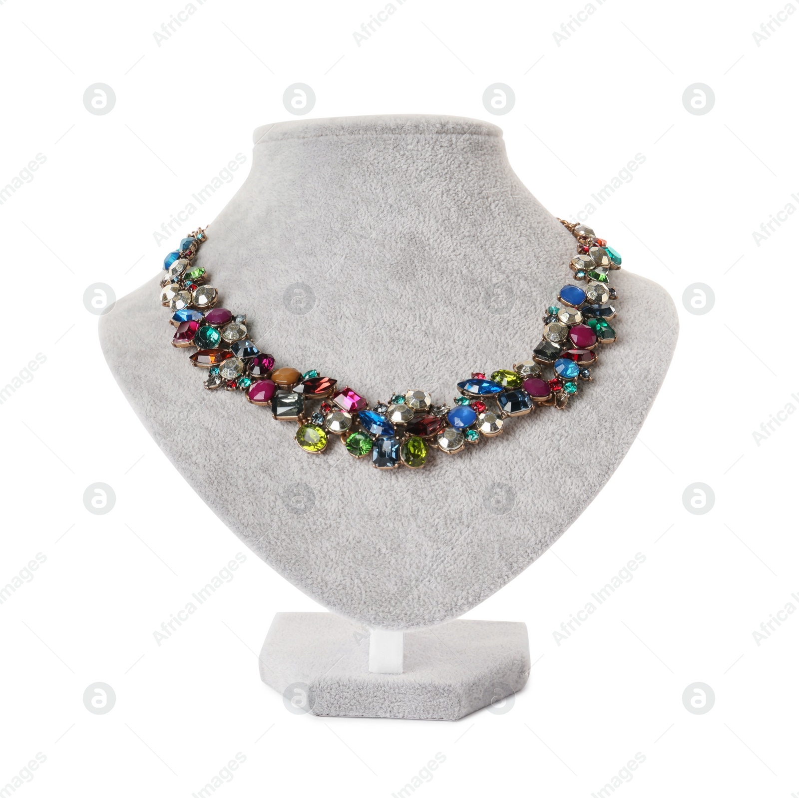 Photo of Stylish necklace with gemstones on jewelry bust against white background