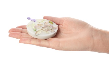 Photo of Woman holding scented sachet with flowers on white background, closeup